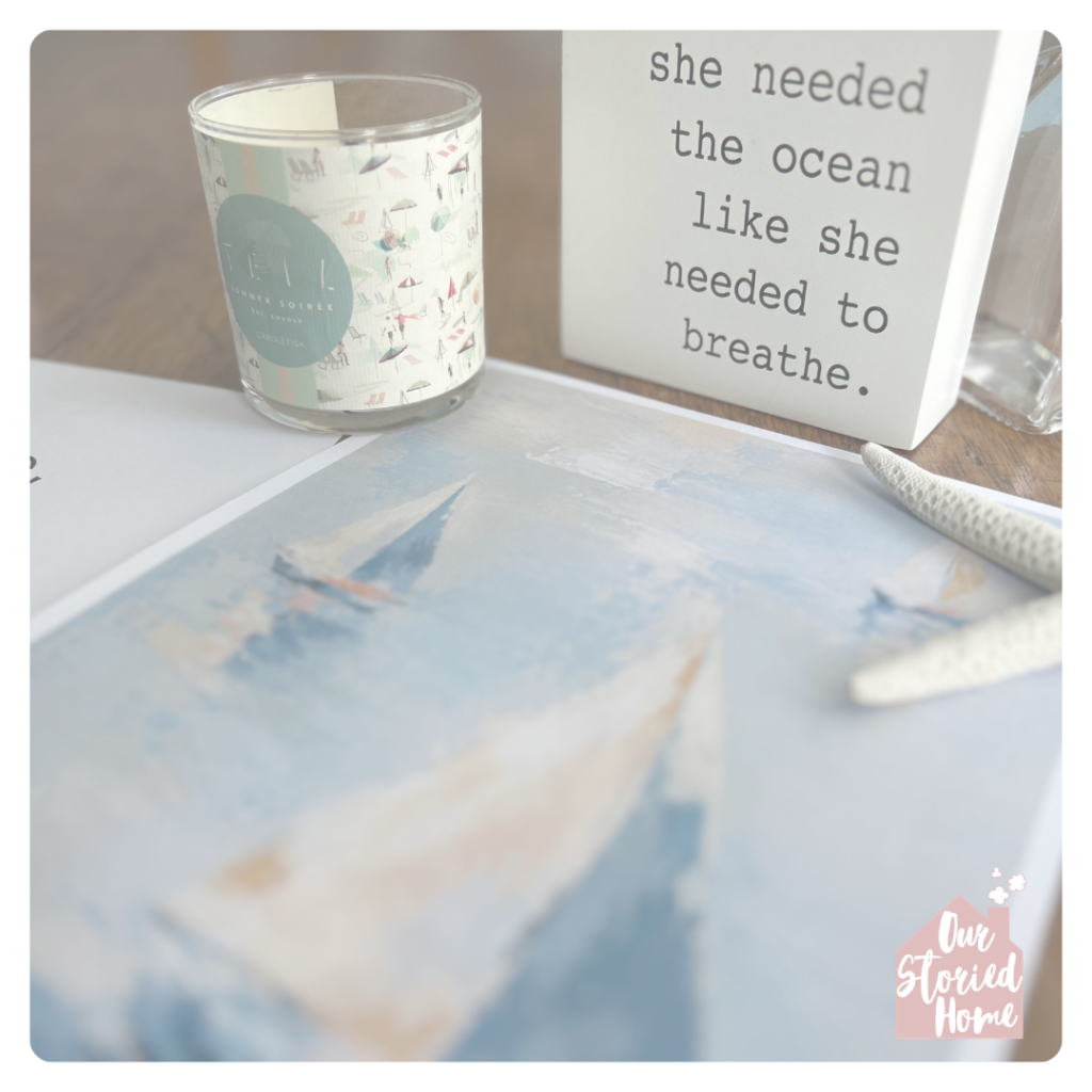 printable sailboats wall art displayed on a table.